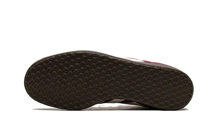Adidas Gazelle Maroon sneaker with black sole and maroon upper.