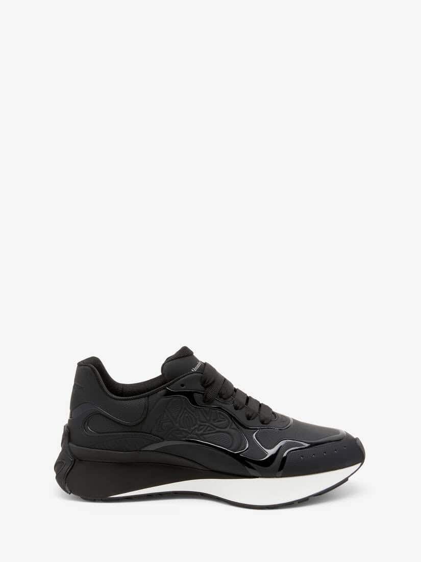 Black Alexander McQueen Sprint Runner sneaker with sleek design and comfortable fit.