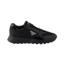 Black Alexander McQueen Sprint Runner sneaker with Prada logo detail.