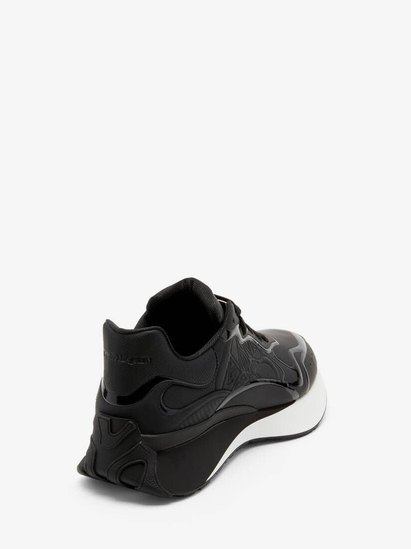 Black Alexander McQueen Sprint Runner sneaker for men and women. Stylish athletic footwear with mode.