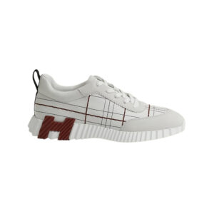 Stylish Hermès bouncing sneakers in black and white with red accents, perfect for modern fashion and.