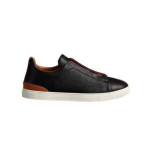 Deerskin sneakers with triple stitch detail in black and brown, stylish and luxurious footwear.