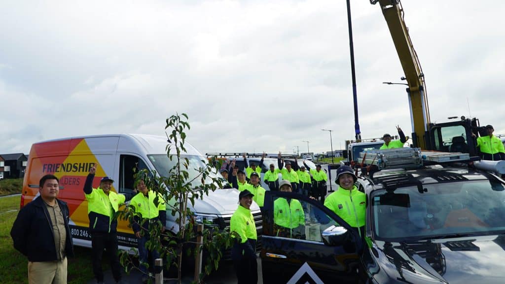 Team of volunteers planting trees for community and environmental support in New Zealand.