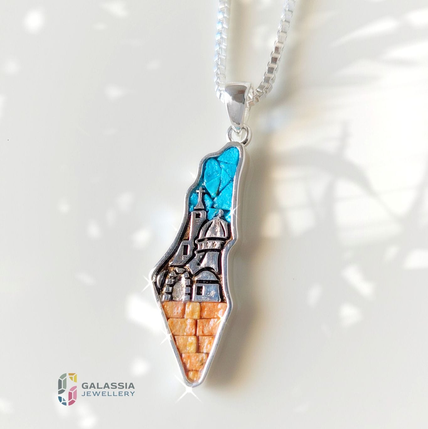Colorful mosaic pendant shaped like Palestine