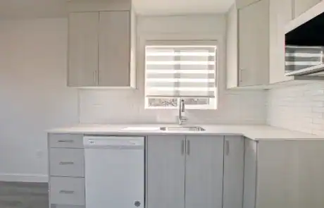 Bright kitchen with window and sleek design.