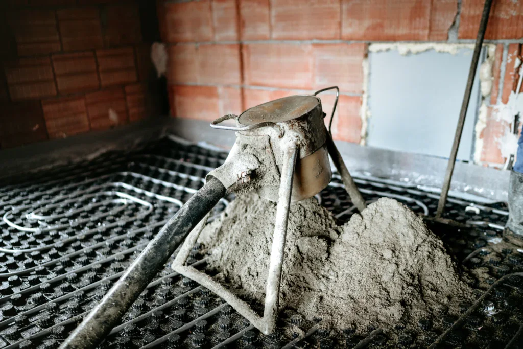 Underfloor heating pipes with concrete screed during construction