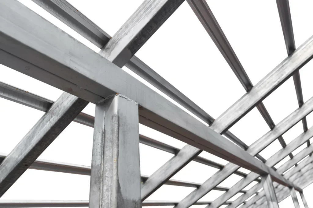 Close-up of a galvanized steel roof truss structure against a white background