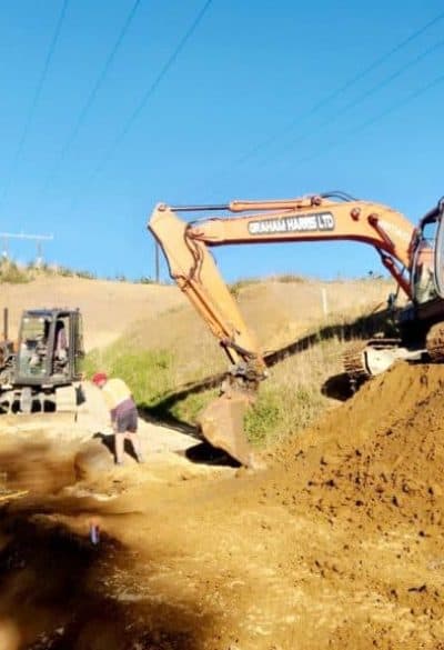 Excavators working on road construction site in New Zealand.