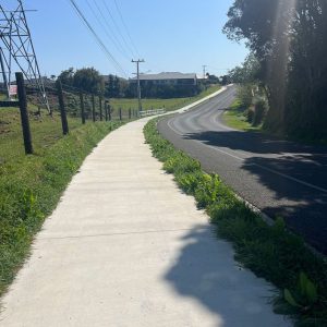 Concrete footpath along a rural road in New Zealand.