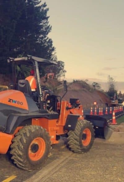 Excavation equipment on road construction site in New Zealand.