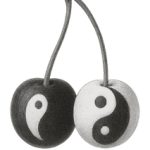 A black and white rendering of a stemmed pair of cherries each resembling the yin/yang symbol. One is predominantly black and the other is inversely predominantly white.