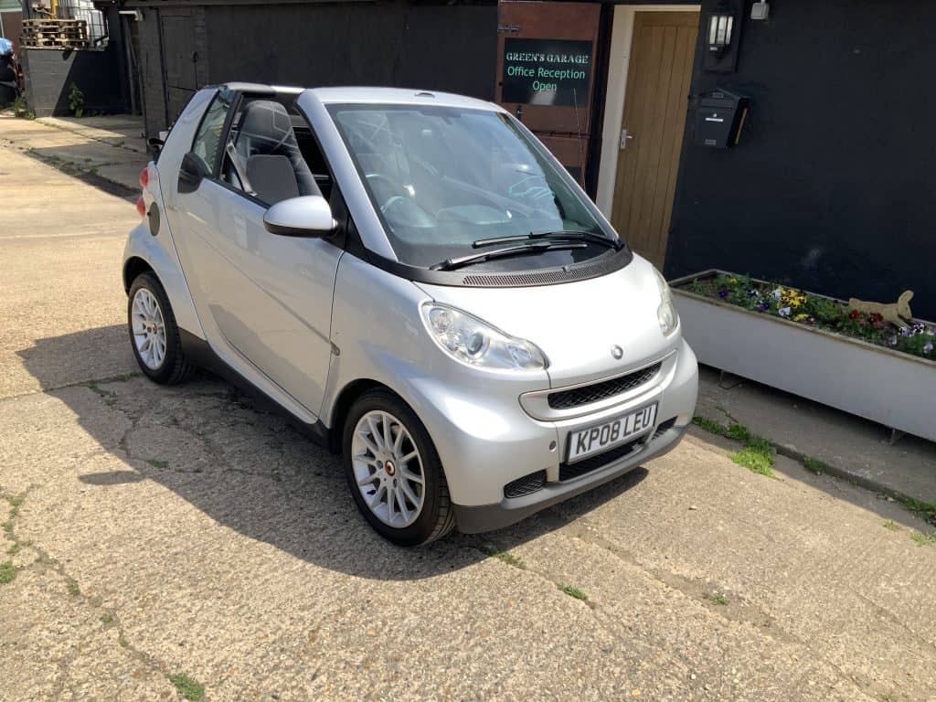 Silver Smart Passion convertible parked outside Greens Garage Suffolk.