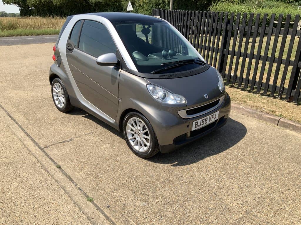 Silver Smart ForTwo Passion parked on a gravel lot in Suffolk.