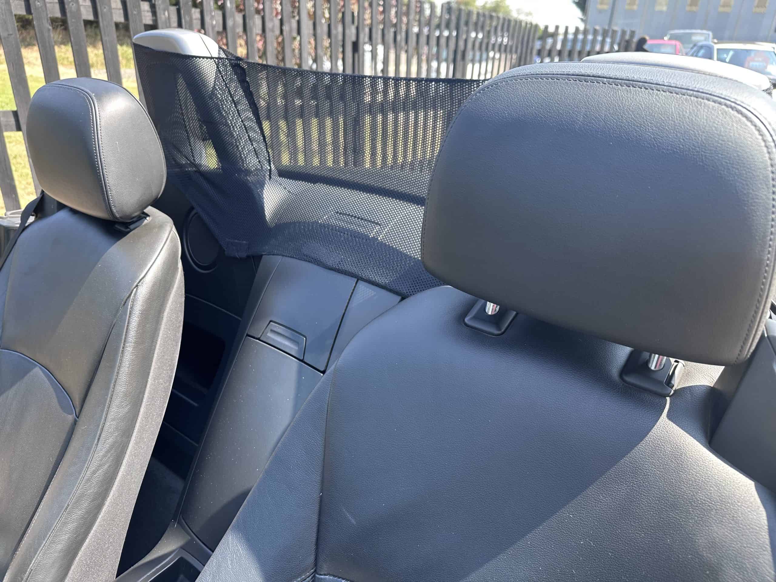 BMW Z4 convertible interior with black seats and headrests.