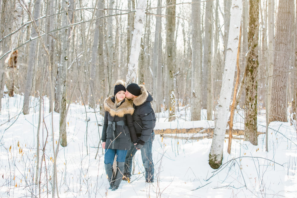 pine grove trail Winter Engagement Session grey loft studio ottawa wedding photographer videographer engagement kanata orleans nepean beautiful locations for engagement photos in ottawa black coats and tan coloured accents with jeans