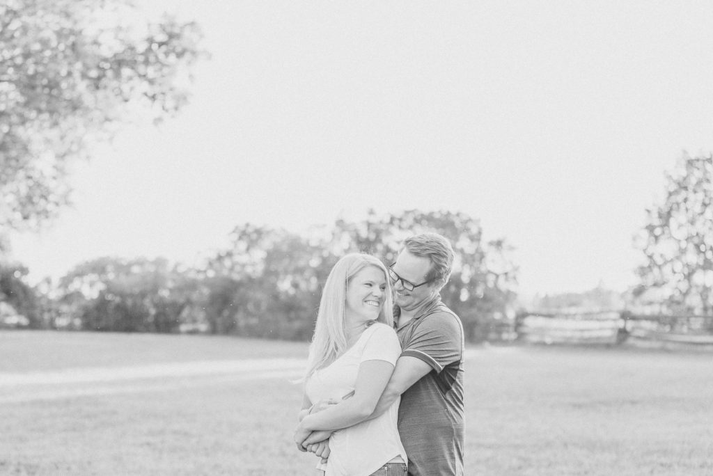 farm in carp on private estate engagement session casual with jeans and white tshirt fun bernese mountain dog shy couple fun engagement session during sunset ottawa wedding photographer grey loft studio kanata wedding carp wedding ottawa valley wedding country wedding engagement photographer ottawa kanata wedding photographer