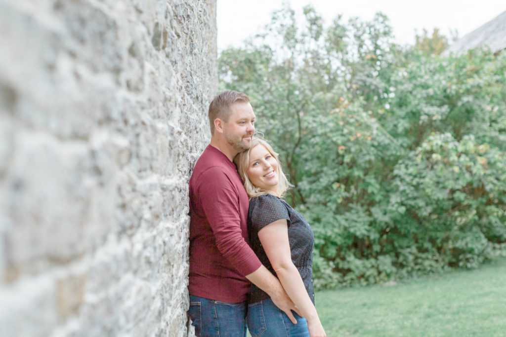 pinhey point engagement session black and burgandy fall colours with puppy uring an engagement session engaged couple walking Ottawa during Sunset  grey loft studio ottawa wedding photographer videographer engagement kanata orleans nepean beautiful locations for engagement photos in ottawa dominion arboretum magnolia blooms spring photos ottawa photo studio puppy ottawa dogs in engagement photos ottawa dunrobin ontario wedding photographer