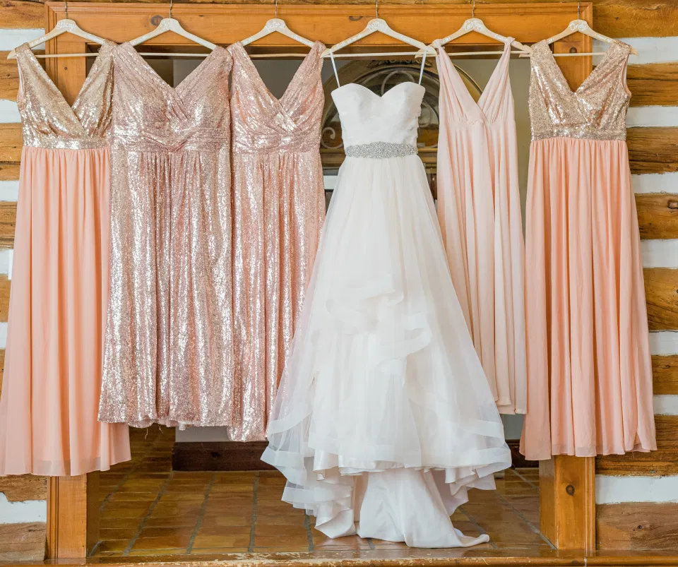 Hanging Wedding Dress with Bridesmaids - Inspiration - Getting Ready Space - Stonefields Estate-  Bright and Airy -  Natural Wedding Posing - Ideas for what to wear for Blush Wedding Photography, Modern Wedding Blush &. Navy Wardrobe inspiration- Unsure of what to wear for your wedding, we've got you! Romantic white with greenery, blush and navy theme. Grey Loft Studio is Stonefields Wedding and Engagement Photographer for Real couples, showcasing photos that are modern, bright, and fun.
