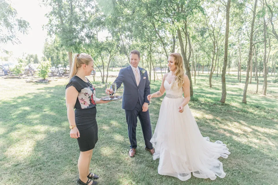 Champagne Toast provided by Venue - Bride and Groom -  Stonefields Estate-  Bright and Airy - Natural Wedding Posing - Modern Wedding Blush &. Navy Wardrobe inspiration-  Romantic white with greenery, blush and navy theme. Grey Loft Studio is Stonefields Wedding and Engagement Photographer for Real couples, showcasing photos that are modern, bright, and fun.