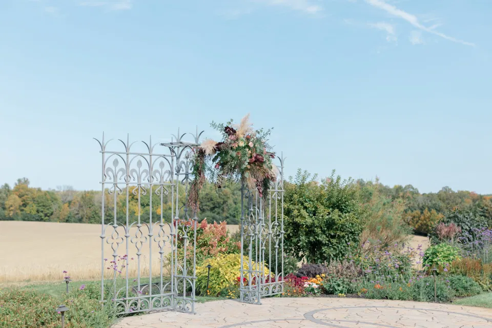 Beautiful Landscapes with beautiful Ceremony Decor -Floral inspiration - Outdoor Ceremony With Wooden Modern Brown Wood Chairs. Interlock, beautiful Landscapes at Evermore Weddings and Events, Almonte Ontario - Grey Loft Studio