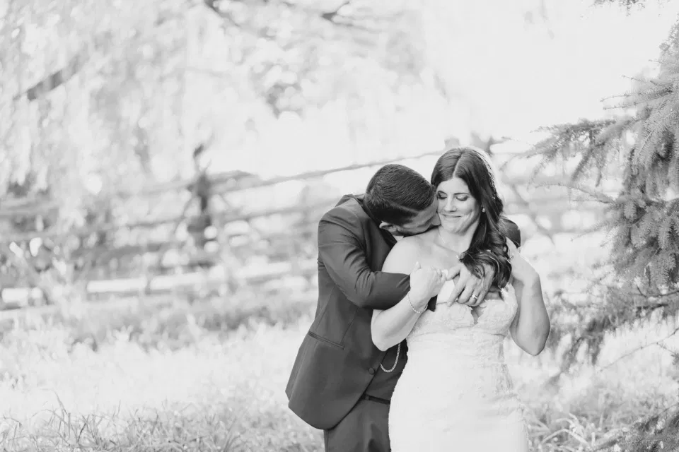 Black and White -  Bride and Groom - Standing in a Field - Off-White, Silver, Greenery. Eucalyptus Leaves. An inspiration filled with soft neutrals, lush florals, and layers of romantic textures all set at Evermore Weddings and Events, Almonte Ontario. 
