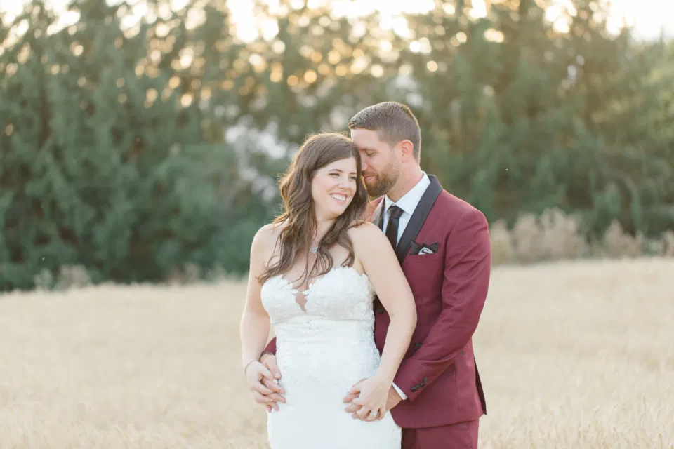 Holding Hands - Bride and Groom Posing at Sunset - Evermore Wedding and Events, Almonte - Bright, Modern, and Fun Wedding Photography. Grey Loft Studio . Wedding Photographer Ottawa. 