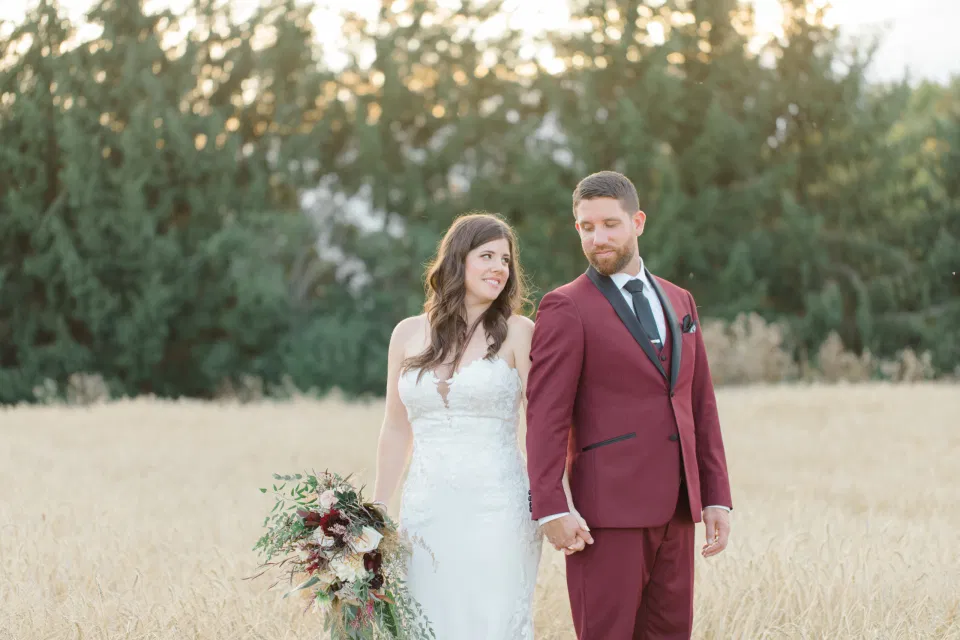 Holding Hands - Bride and Groom Posing at Sunset - Evermore Wedding and Events, Almonte - Bright, Modern, and Fun Wedding Photography. Grey Loft Studio . Wedding Photographer Ottawa. 