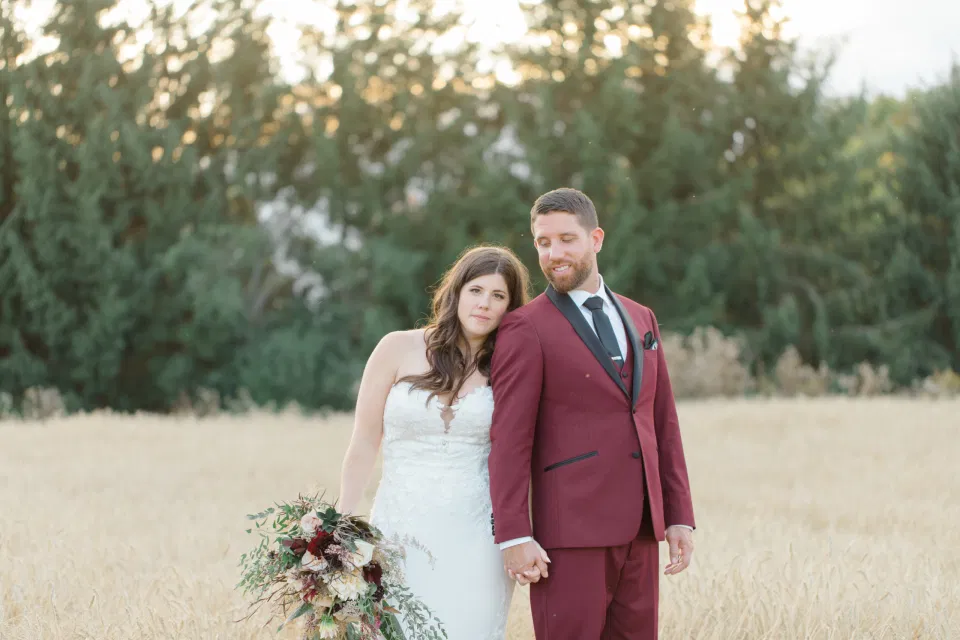 Holding Hands - Bride and Groom Posing at Sunset - Evermore Wedding and Events, Almonte - Bright, Modern, and Fun Wedding Photography. Grey Loft Studio . Wedding Photographer Ottawa. 