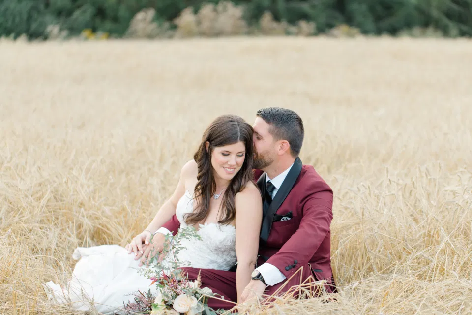 Sitting in a Wheat Field - Holding Hands - Bride and Groom Posing at Sunset - Evermore Wedding and Events, Almonte - Bright, Modern, and Fun Wedding Photography. Grey Loft Studio . Wedding Photographer Ottawa. 