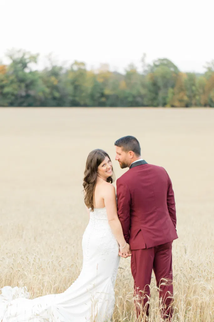 Standing in a Wheat Field - Sitting in a Wheat Field - Holding Hands - Bride and Groom Posing at Sunset - Evermore Wedding and Events, Almonte - Bright, Modern, and Fun Wedding Photography. Grey Loft Studio . Wedding Photographer Ottawa. 