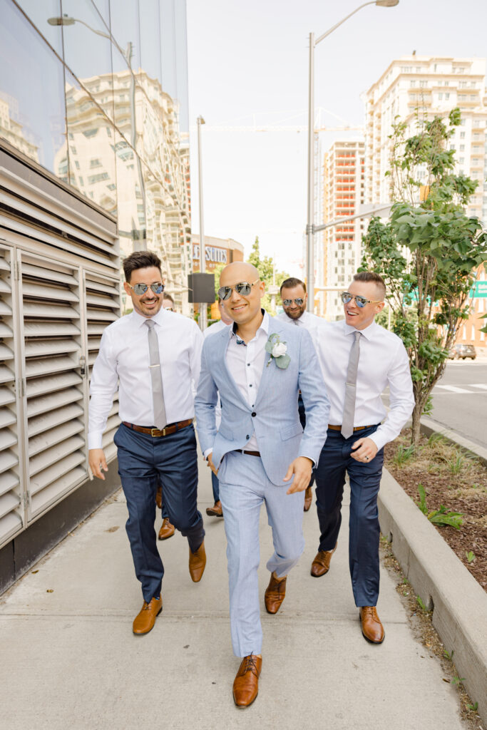 candid groom and groomsmen photos downtown ottawa near OAG