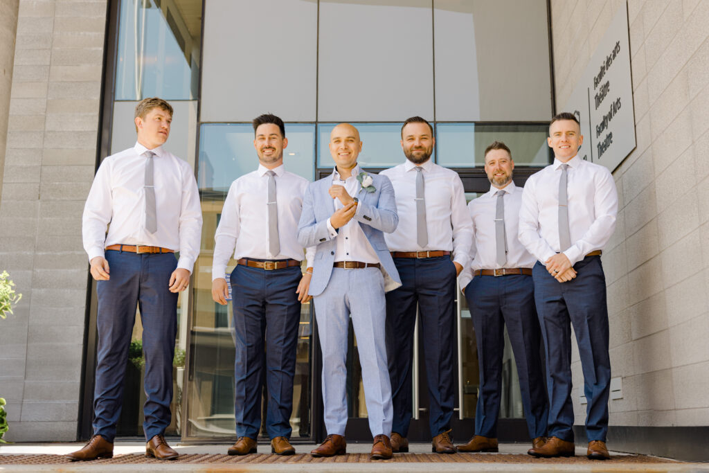candid groom and groomsmen photos downtown ottawa near OAG