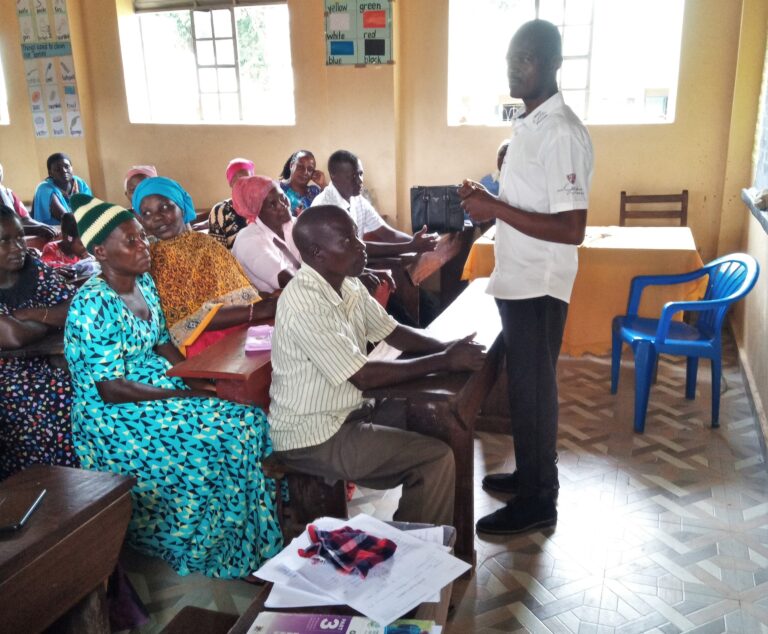 GRiD founder facilitating a community dialogue on challenges affecting vulnerable households, adolescent girls, and community wellbeing