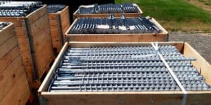 Pallets filled up with GroundPlug® TwisterTM Screw Piles. What are screw piles? It is a type of steel foundation for construction projects.