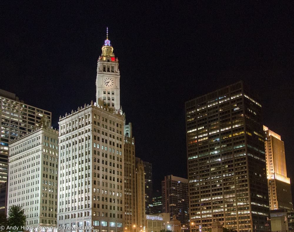 Wrigley building at night from boat
