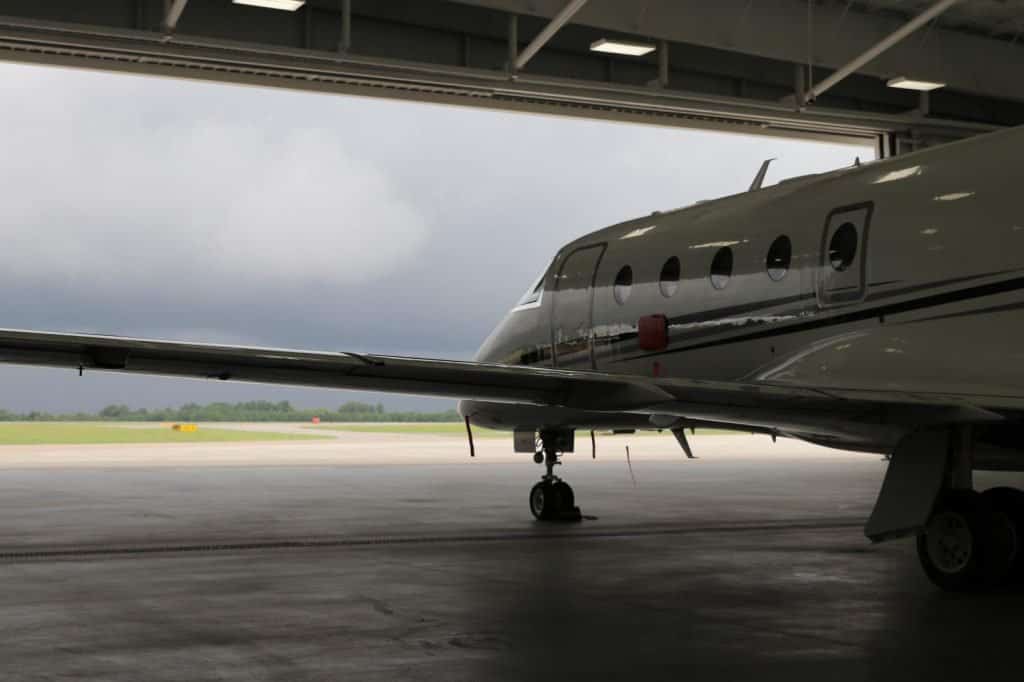 Private jet in hangar on cloudy day at GSP airport