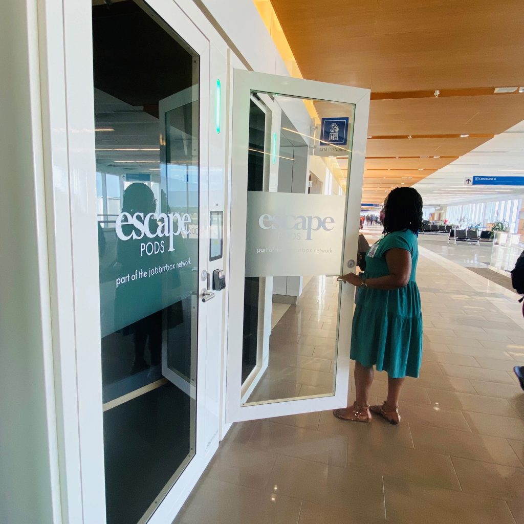 Woman enters Escape Pod private workspace