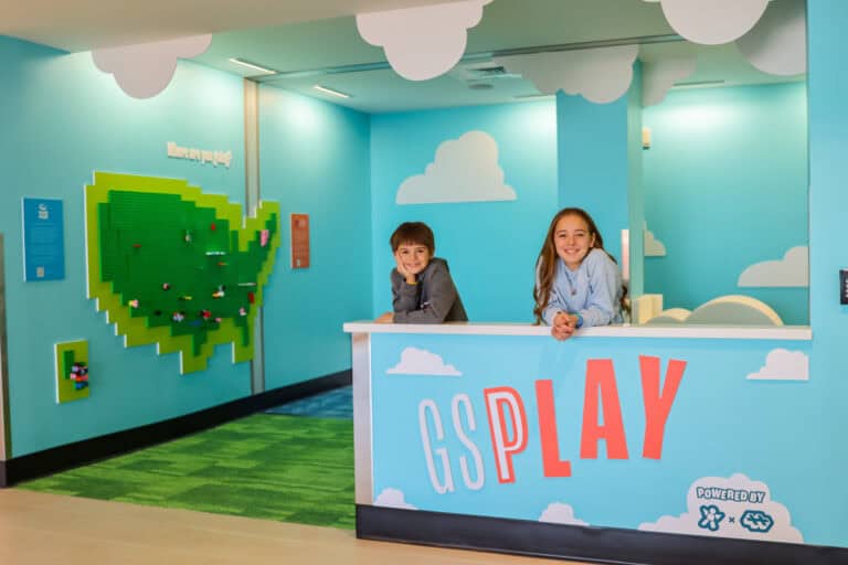Two kids playing in the GSPlay area