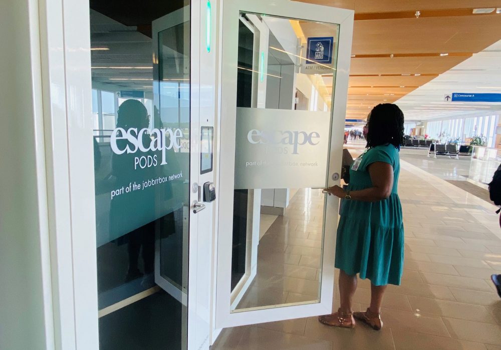 Woman enters Escape Pod private workspace