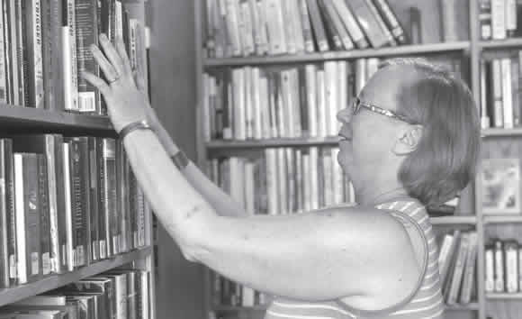 Janet Nelson-Cox giving a tour of the Book Nook at Gunnison Library.