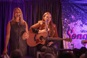 Gunnison Tough Executive Director, Heidi Sherratt, introduces the 2025 Winter Songwriter Shuffle concert.