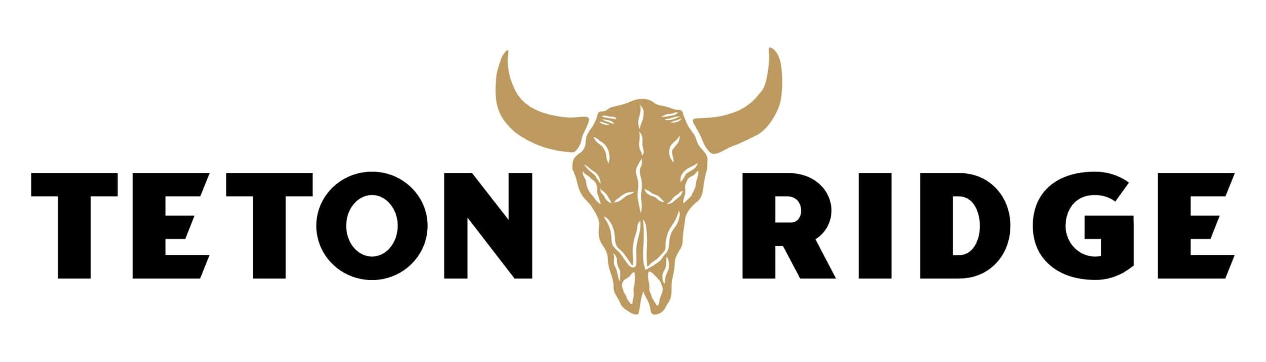 Teton Ridge Logo with a gold cow's skull in the center.