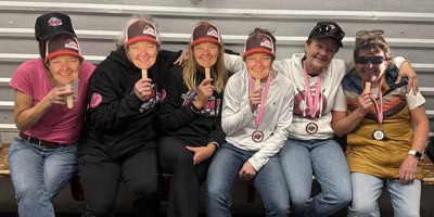 GT March Newsletter thumbnail shows the real Lisa Lynch and 5 look-alikes at the 2026 Pink in the Rink.