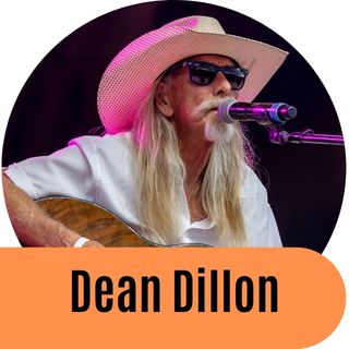 Dean Dillon singing and playing his guitar.
