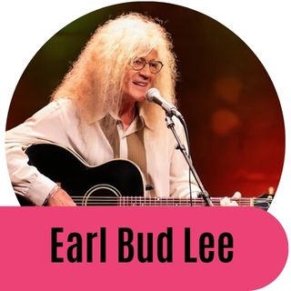 Earl Bud Lee in a closeup wearing sunglasses with his hair blowing across his face and a big smile.