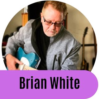 Dean Dillon singing and playing his guitar.