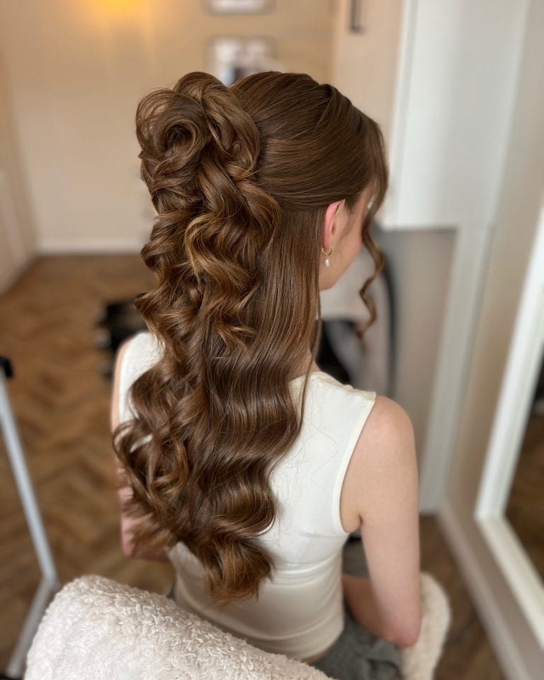 Curled Half Up Half Down Prom Hairstyle with Voluminous Twist