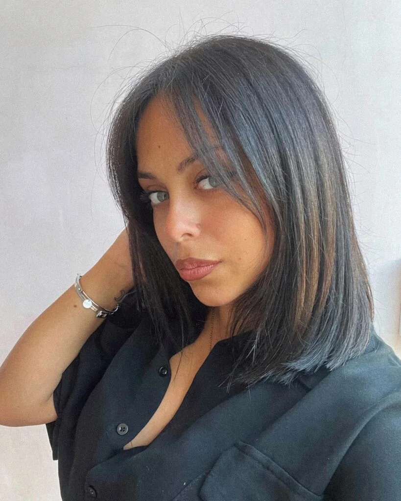 Long bob paired with wispy curtain bangs
