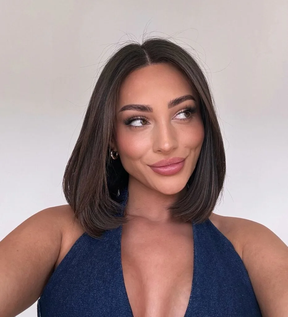 Polished brunette long bob with a sleek center part