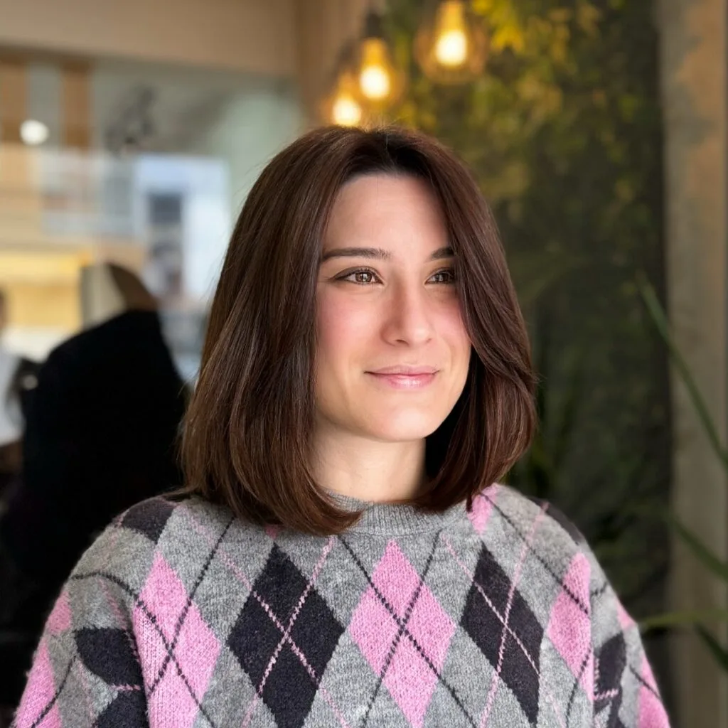 Rounded long bob with face-framing layers and shoulder length